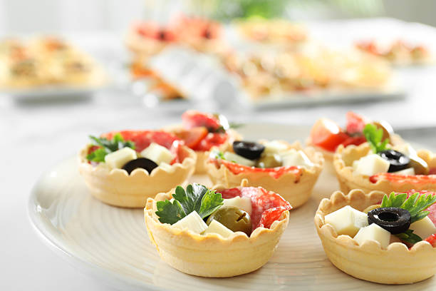 elegantly arranged charcuterie board displaying various meats, cheeses, fruits, and nuts. It symbolizes the joy of abundance and shared experiences, emphasizing the importance of enjoying life