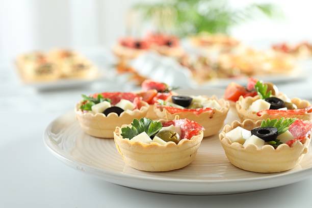 istock Many tasty canapes on white table, closeup 2244219062