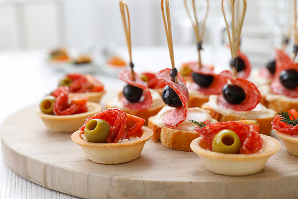 Bacon on bread sticks in glasses delicious traditional food on wedding party katering