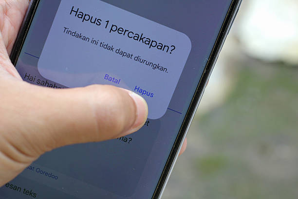 istock Deleting messages on smartphone screen is a digital lifestyle choice for privacy and data management in the modern mobile age 2244221999