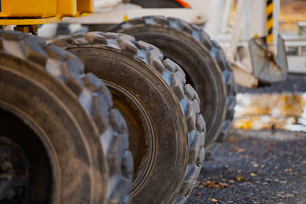 istock Multi-axle construction vehicle with reinforced tread tires engineered for stability, load distribution, and traction efficiency in industrial transport and site mobility tasks 2244229117