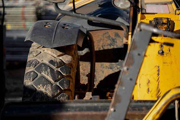 man operating a backhoe machine
