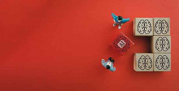 Machine Learning,Artificial Intelligence(AI),Technology for business concept.,Business man looking red wooden cube with robot brain icon on red background idea for business,technology,financial.