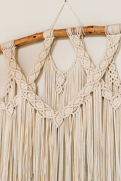 istock Macrame wall hanging with intricate patterns and elegant fringe in a cozy home setting 2244229718