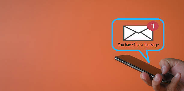 istock New Email Notification: Hand Holding Smartphone with Inbox Message Alert on Orange Background 2244231713