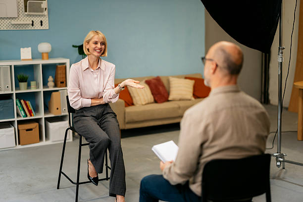 istock Businesswoman giving interview at tv studio set 2244236792