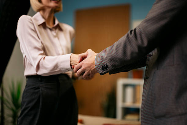 istock Business people shaking hands in agreement 2244236883