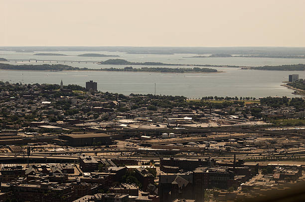 istock Aerial View of Bustling Coastal Metropolis with Bridge and Waterfront 2244241781