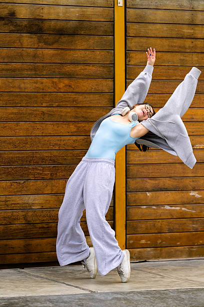 istock Teenager dancing street showing flexibility and joy 2244242811