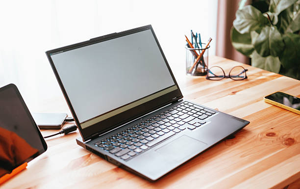 istock Workspace setup with laptop on desk, minimalistic design and natural light 2244246112
