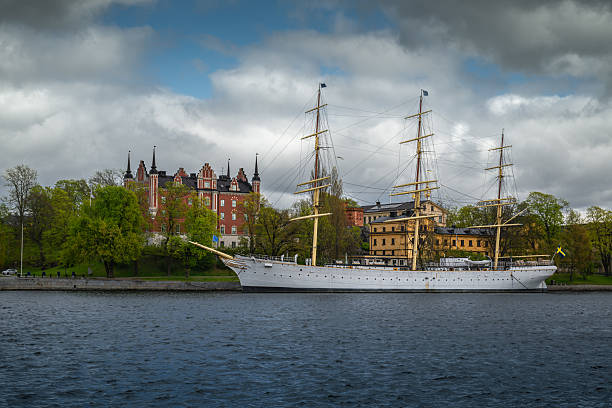 A sailboat rests quietly moored along Stockholm’s scenic waterfront.