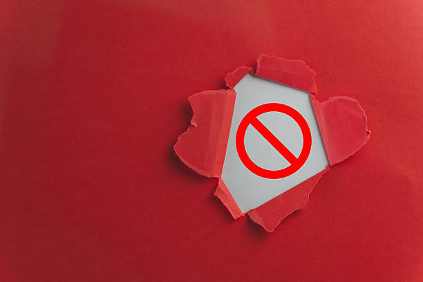 istock Important Warning: Alert Icon with Exclamation Mark Revealed in Torn Red Paper 2244255372