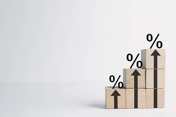 istock Interest Rate Growth: Percentage Signs and Arrows Increasing on Wooden Block Steps.,copyspace. 2244255745