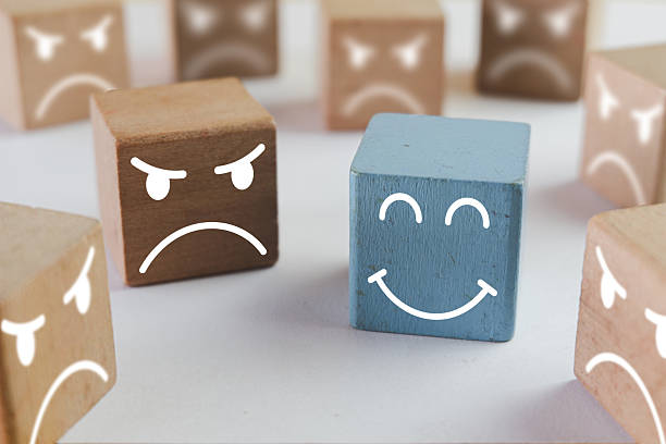 istock Customer Satisfaction and Positive Feedback: Happy Face Icon Stands Out from Angry Crowd 2244257239
