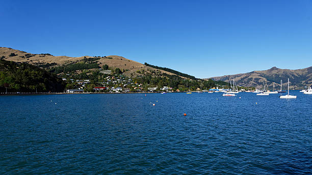 istock Akaroa Harbour and town, viewed from the sea 2244257972