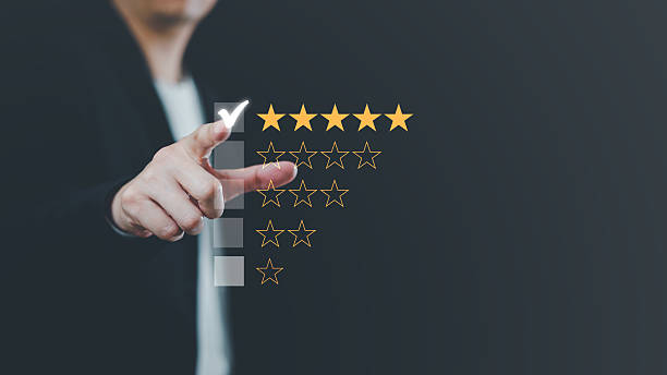 istock Hand touching and making a five-star yellow mark on a black background is customer satisfaction and the best evaluation for good quality products and services 2244258043