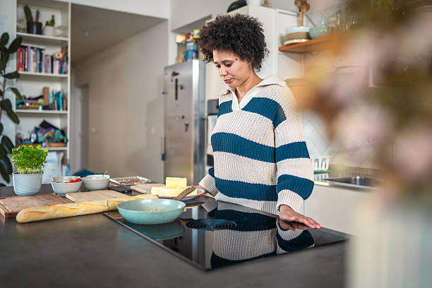 istock Diverse Female Toasting Pine Nuts on Modern Cooktop 2244260030
