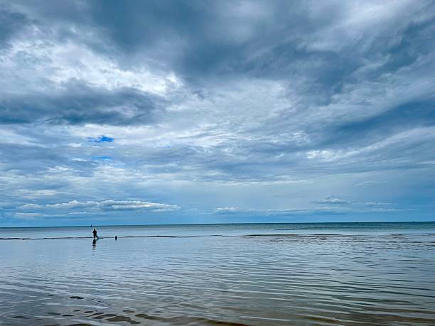 istock Man fishing beach 2244260413
