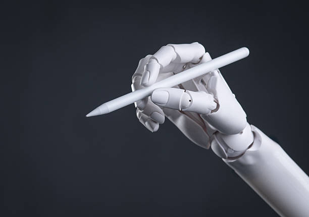 istock Robot Hand Holding a Digital Stylus: AI Art, Design, and Precision Technology Concept 2244262034