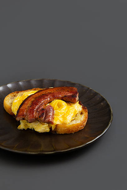 Open sandwich with Scrambled eggs and bacon.