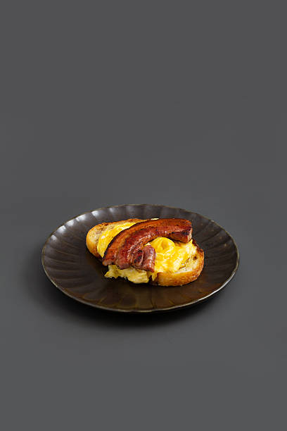 Open sandwich with Scrambled eggs and bacon.