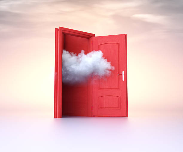 istock Open red door with clouds emerging, symbolizing possibilities and transitions in a serene setting 2244263552