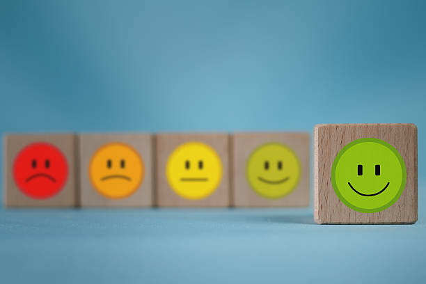 istock Excellent Satisfaction: Green happy face icon in focus for positive customer feedback. 2244265616