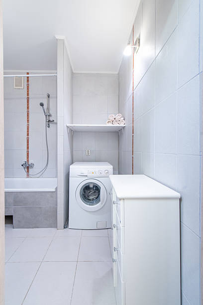 istock Modern Bathroom Interior with Shower, Bathtub, and White Ceramic Fixtures 2244274011