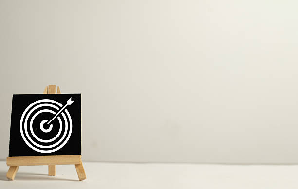istock Business goal concept, target dartboard icon on a mini blackboard easel with copy space for strategy and objectives. 2244274283