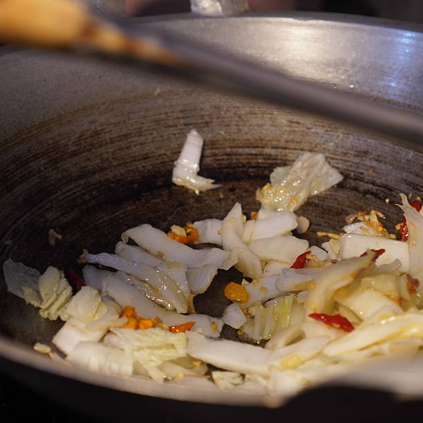 istock Action of stir-frying fresh vegetables 2244274436