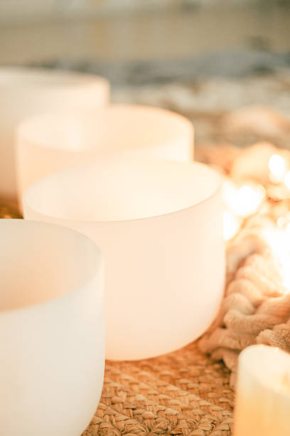 istock Soft glowing crystal singing bowls creating harmony and feminine energy for meditation 2244274502