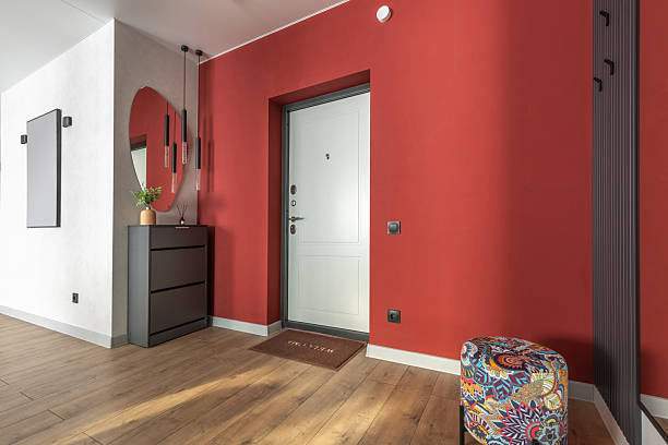 istock Modern Hallway Interior with Red Wall and Minimalist Decor 2244274539