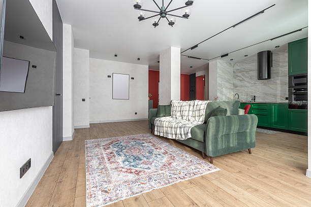 istock Modern Living Room and Kitchen Interior with Green Sofa 2244274545