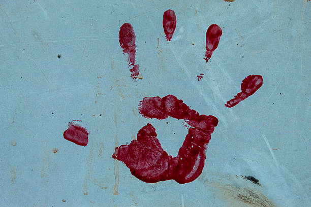 Handprint with red paint on the white background