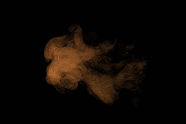 istock Orange dust smoke cloud isolated on black background, realistic powder explosion and fog texture for motion effect, destruction concept, or abstract visual design in digital artwork. 2244276222