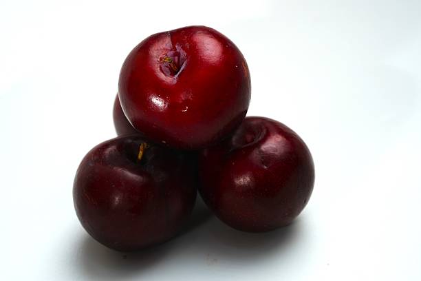 istock Fresh ripe red plums close-up for healthy eating 2244276480