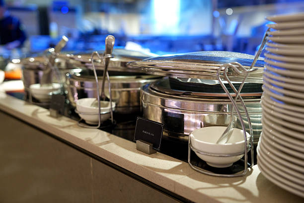 istock Stainless Steel Buffet Chafing Dishes on Self-Service Counter 2244276636