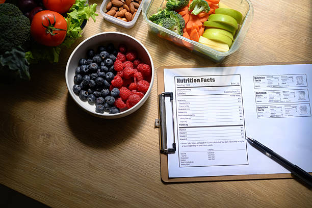 istock Nutritionist concept, Fruit and vegetable on table with Nutrition Facts on table 2244277104