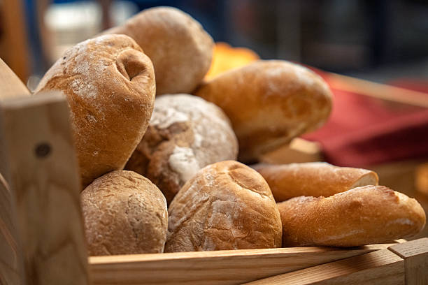 Assorted Fresh Sourdough Bread Rolls in Wooden Basket