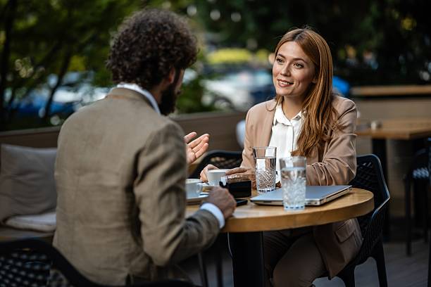 istock Business people discussing at outdoor cafe table during coffee break 2244277460
