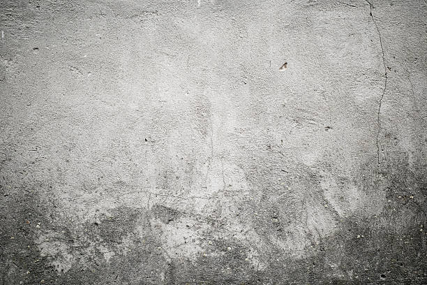 Texture gray wall background with cracked grunge plaster, full frame