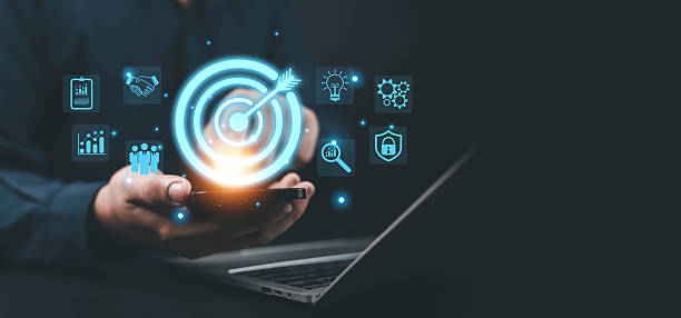 istock Businessman holding smartphone with digital target icon, representing business success, marketing strategy, goal achievement, innovation, and data analytics for management, growth, digital concepts. 2244284385