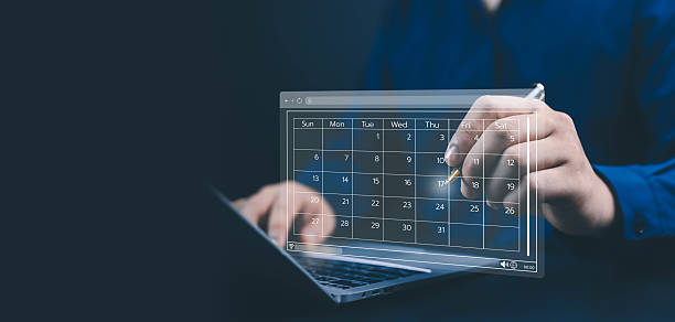 istock Businessman using laptop with digital calendar interface, symbolizing time management, schedule planning, productivity, organization, and business efficiency through modern technology and project 2244284421