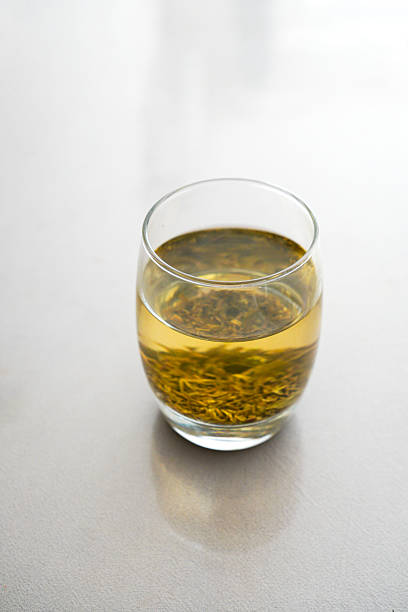 istock A glass of green tea with visible tea leaves inside 2244285030