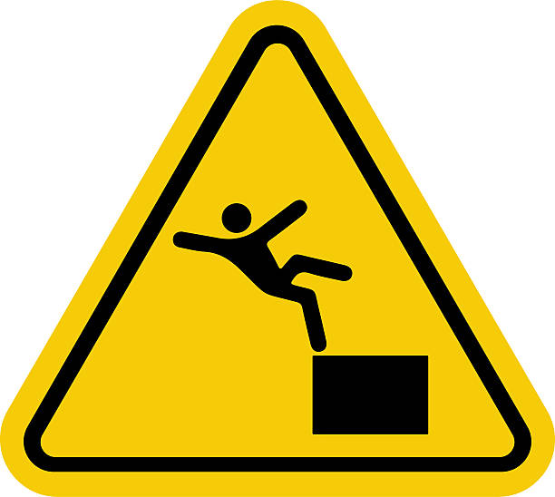 Warning Triangle Sign With Falling Figure Indicating Hazard And Fall Risk A bright yellow triangular warning sign displays a black silhouette of a person slipping from a platform, signaling danger and fall risk. Ideal for safety, construction, and hazard awareness contexts. trapezoid-shape-silhouette stock illustrations