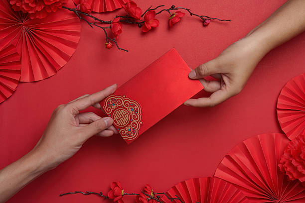 Exchanging red envelopes during Chinese New Year