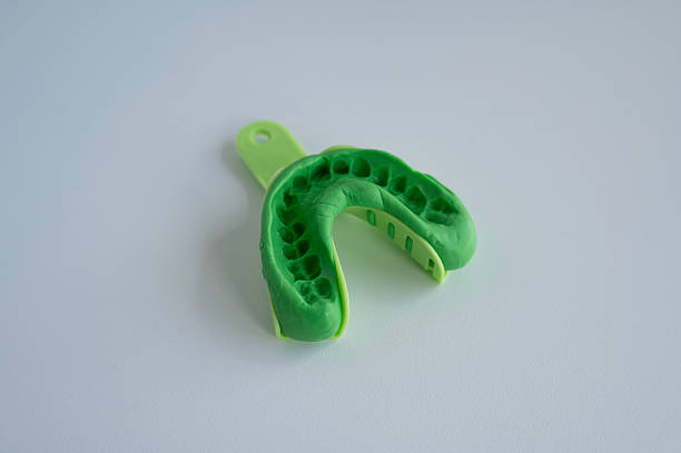 istock Green Dental Impression Trays on White Background 2244292723