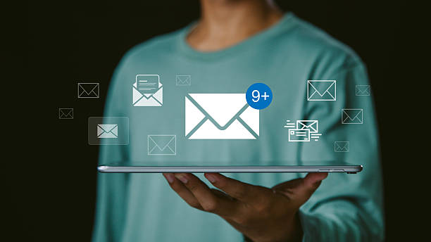istock A person using a digital tablet with email icons and message notifications, representing online communication, email marketing, business technology, and modern digital correspondence. 2244294402