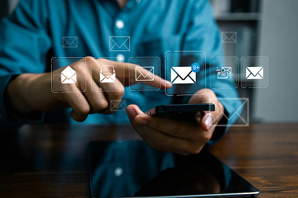 istock A person using a digital tablet with email icons and message notifications, representing online communication, email marketing, business technology, and modern digital correspondence. 2244294403