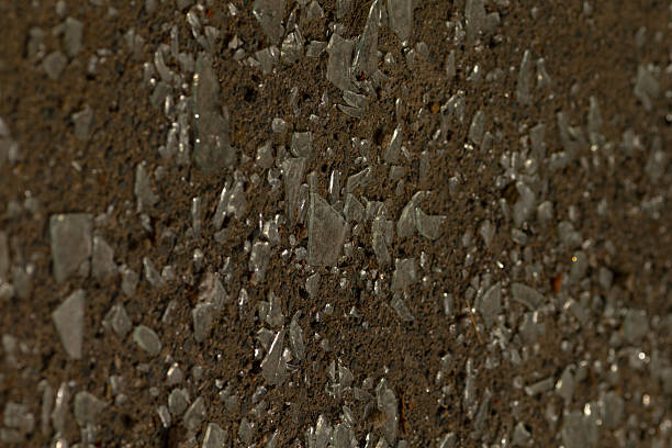 istock Image shows a closeup of a brown surface with scattered small stones 2244294932